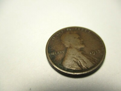 1912 Lincoln wheat penny off-center strike error showing blank crescent and shifted design